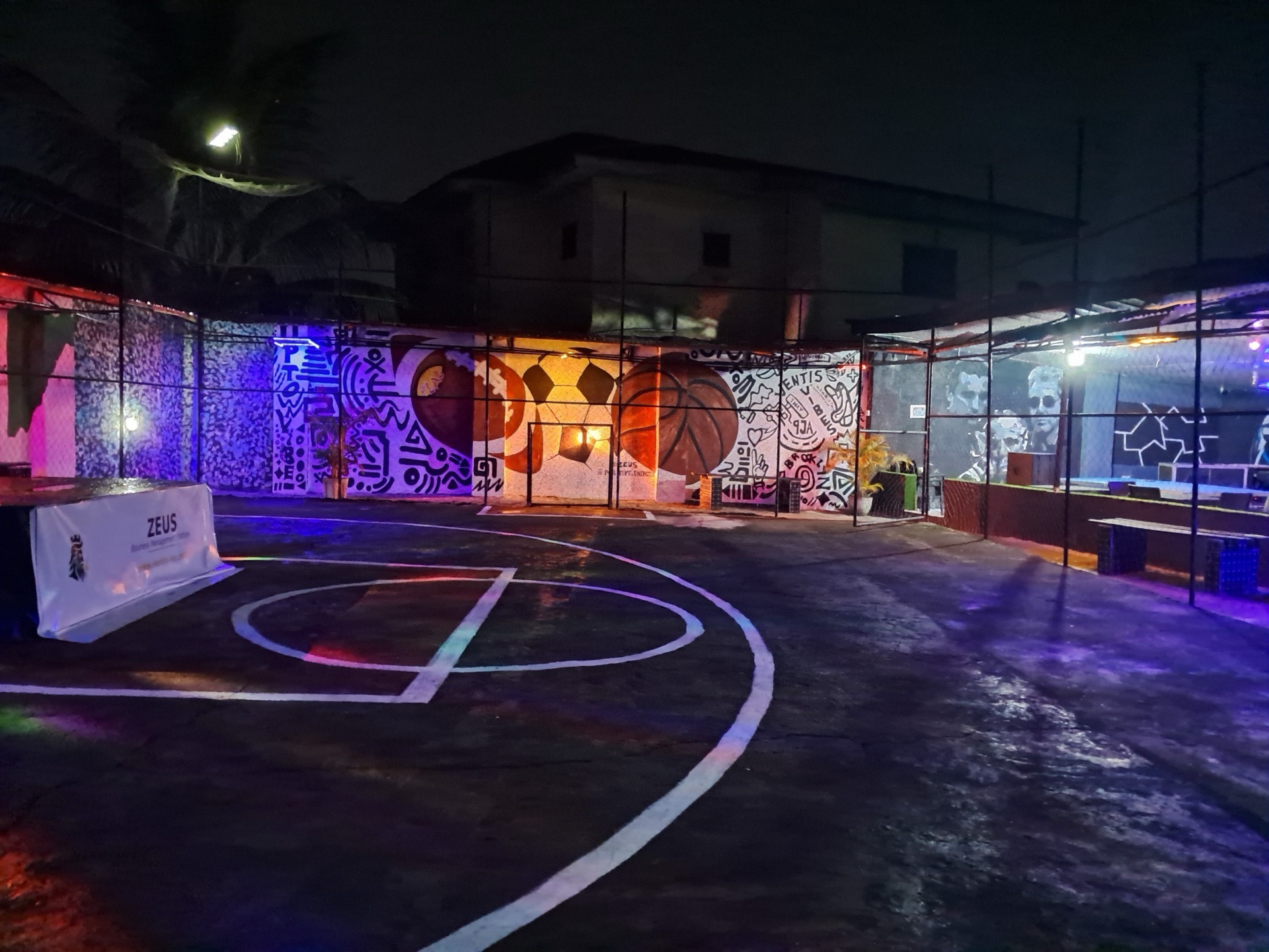 Thenty Playground basketball court at night